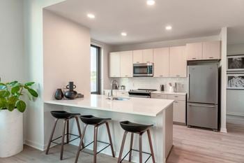 Modern gourmet kitchen accented with custom cabinetry